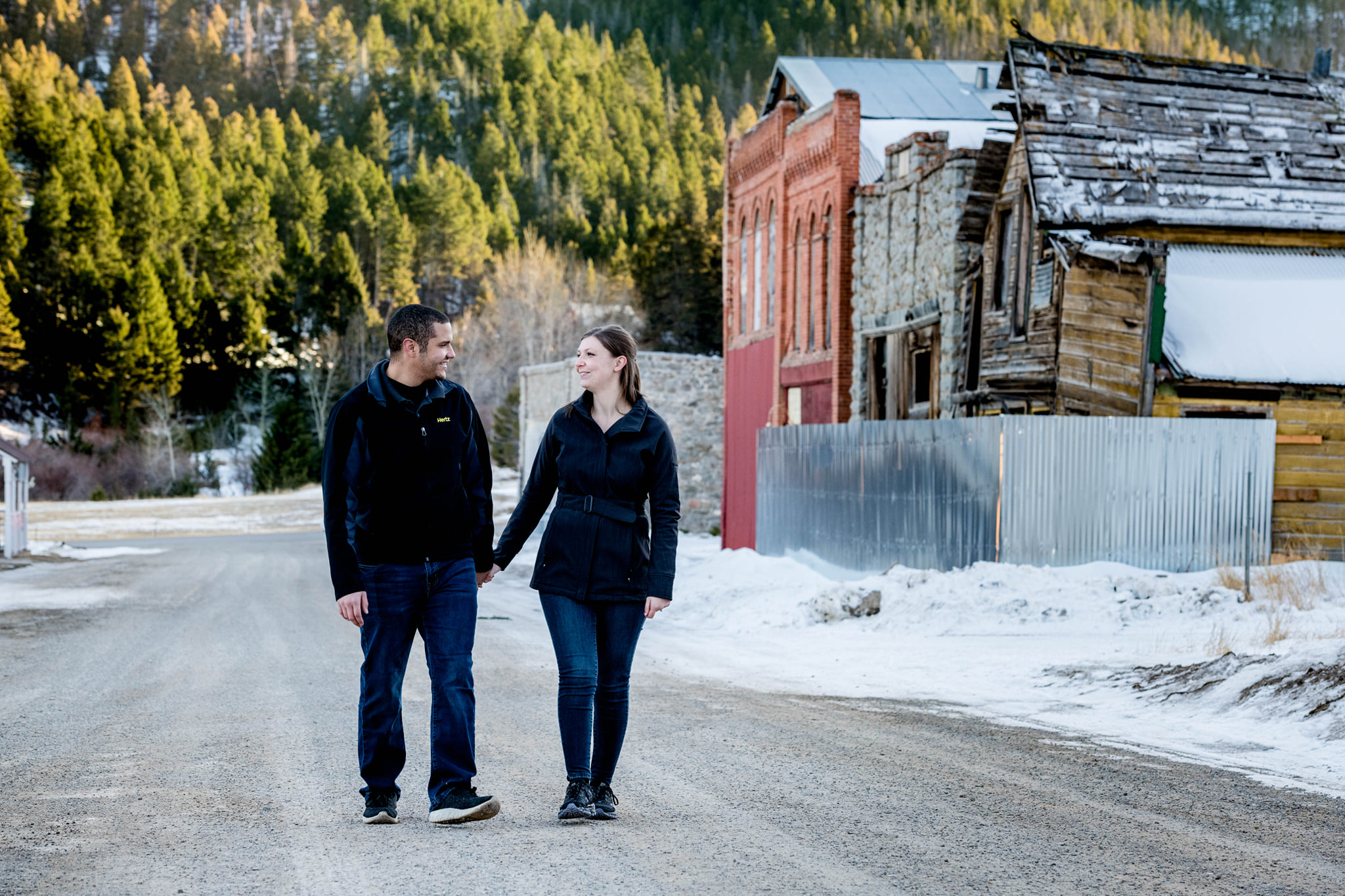 couple walking down historic downtown street in the mountains