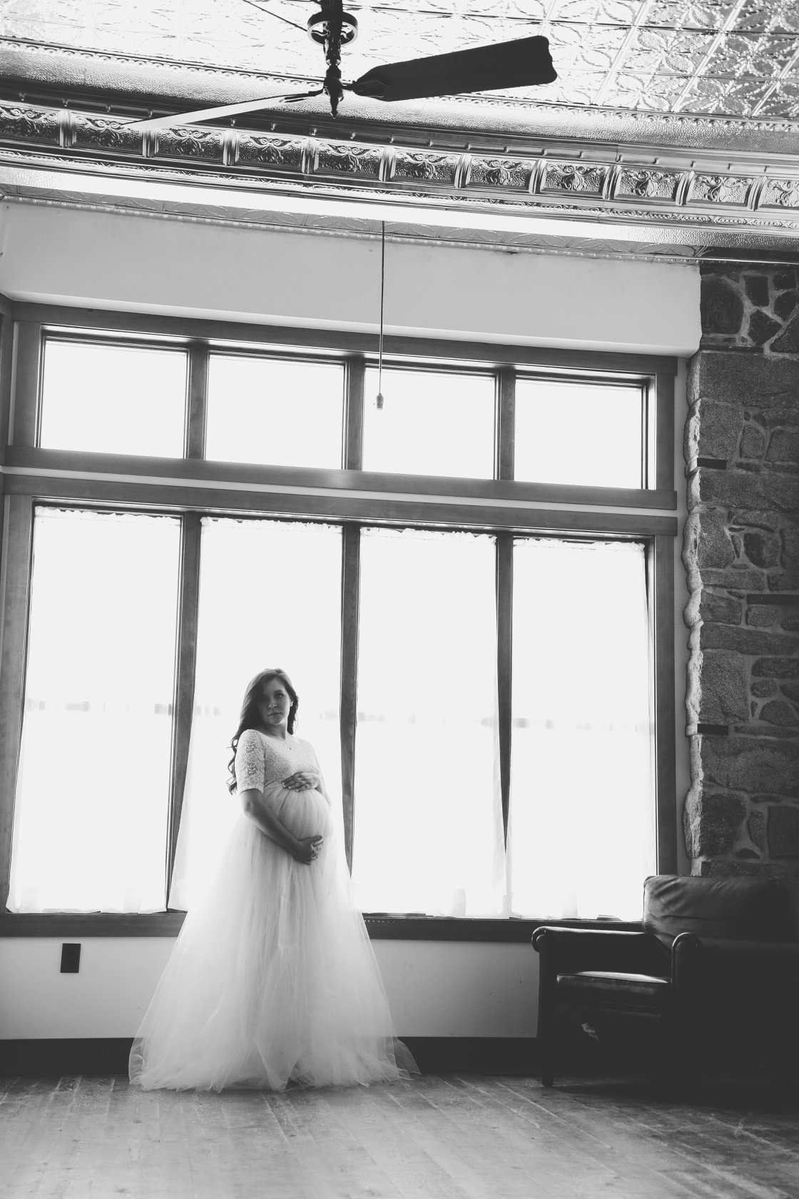 black and white maternity photo in historic venue