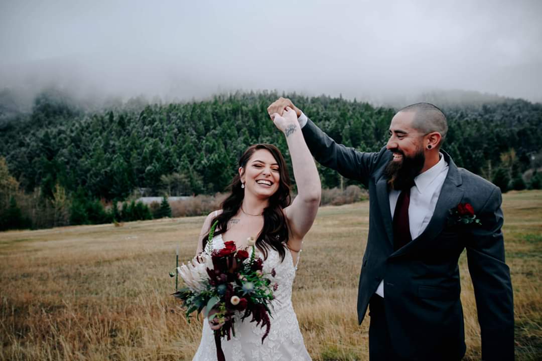 groom twirling bride