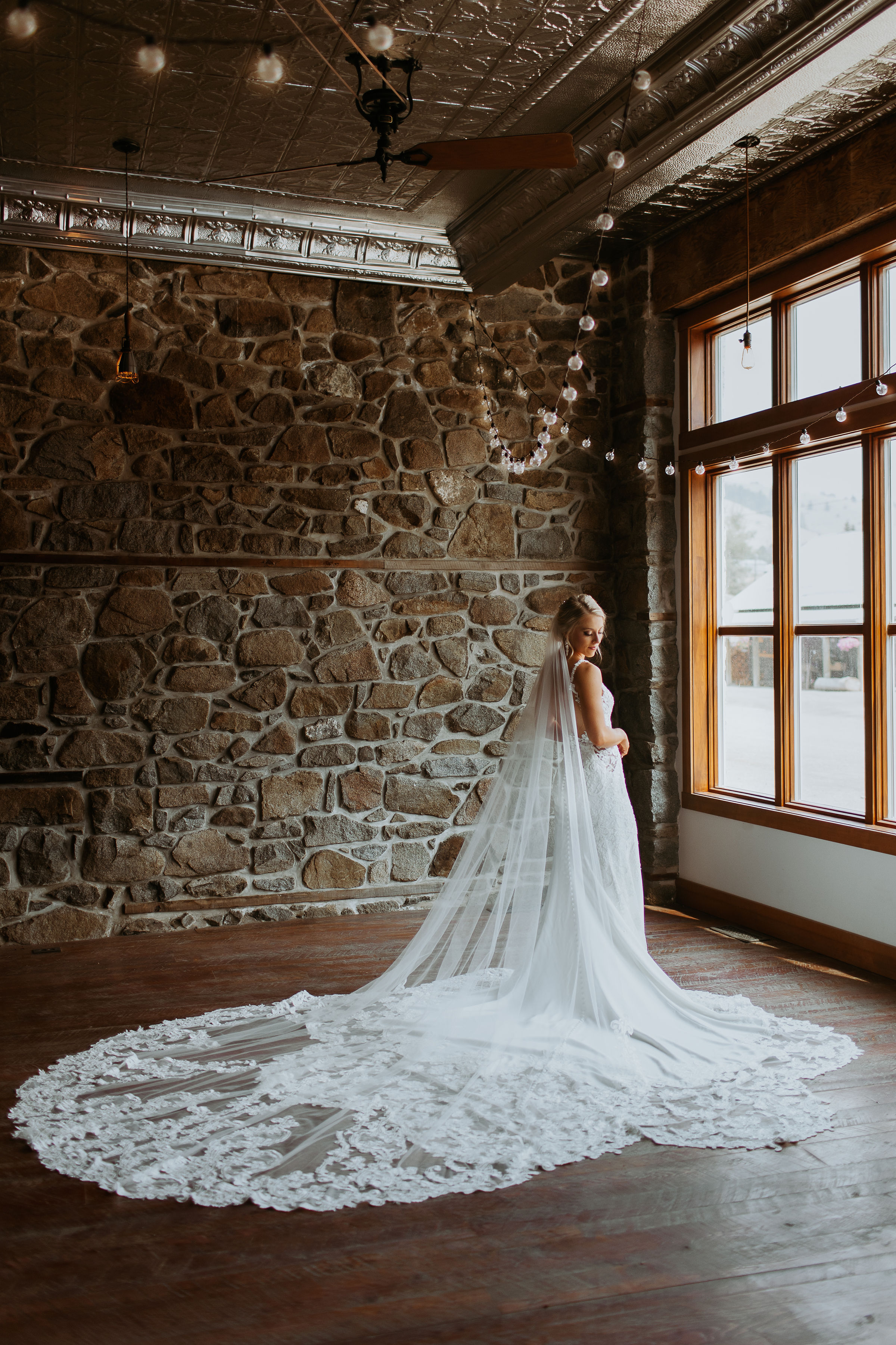 bride with long lace veil and train